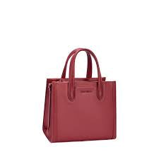 David Jones brand top-handle tote bags displayed on a shelf.