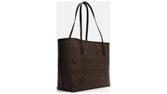 Coach Women's City Tote bag in brown/black signature coated canvas.