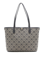 Tory Burch T Monogram Small Zip Tote featuring a woven navy blue jacquard pattern and leather trim.
