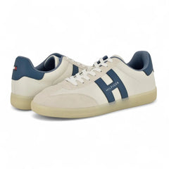Tommy Hilfiger Men's Berge T-Toe sneakers featuring a prominent blue "H" logo on the white upper.
