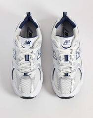 New Balance 530 sneakers in a white and navy