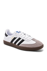 Adidas Samba OG shoes in white with black stripes.
