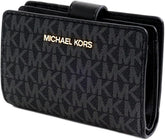 Michael Kors wallet features the brand's signature monogram pattern in black with prominent