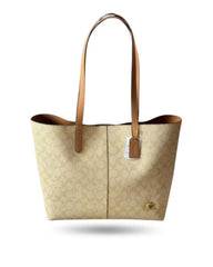 Coach 6931 Signature Canvas Tote Bag in beige.