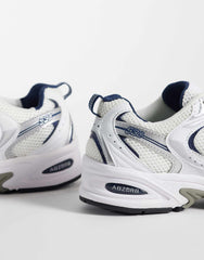 New Balance 530 sneakers in a white and navy
