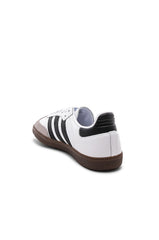 Adidas Samba OG shoes in white with black stripes.