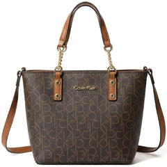 Calvin Klein women’s shoulder bag features a brown monogram pattern and gold
