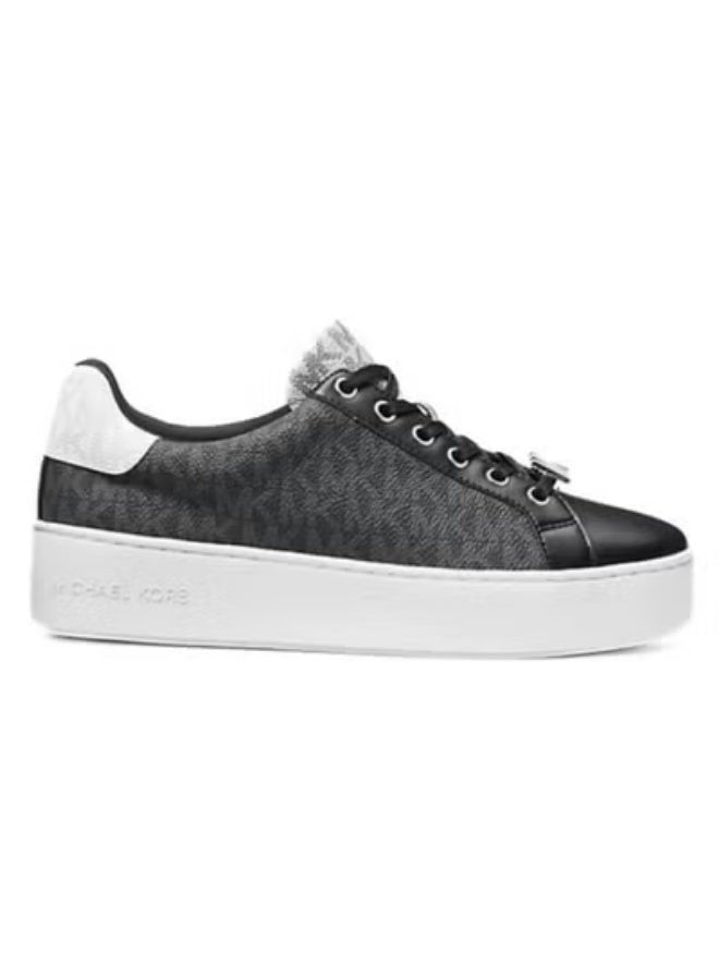 Michael Kors Poppy sneakers feature a black monogram pattern with a distinctive silver metallic