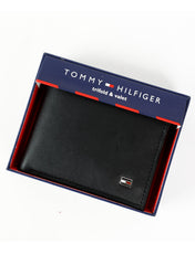 This is a black Tommy Hilfiger leather wallet packaged in a branded gift box
