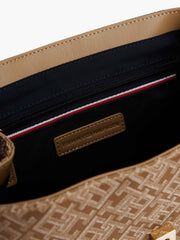 Tommy Hilfiger monogram jacquard flap backpack featuring a classic tan and brown